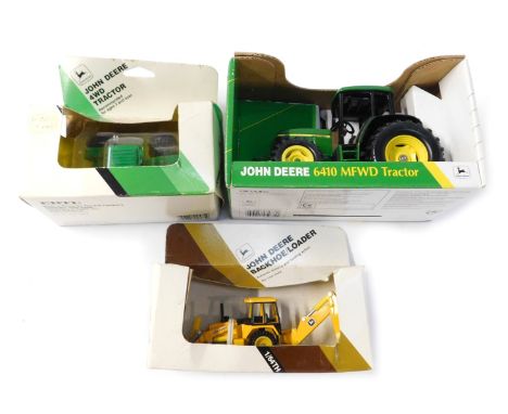 Three Ertl John Deere tractor models, comprising the 4WD tractor, the backhoe/loader, the 6410 MFWD tractor, boxed. (3)