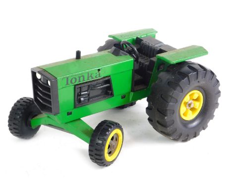 A Tonka Toys John Deere tractor. 