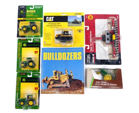 A group of agricultural diecast vehicles, comprising Ertl 1200 planter, Ertl John Deere 1934 model A tractor, Ertl 7820 John 