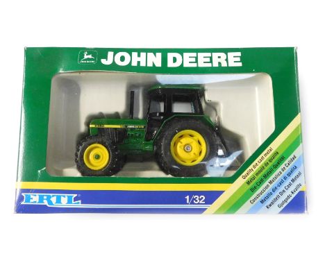 An Ertl John Deere 1-32 scale diecast model, boxed. 