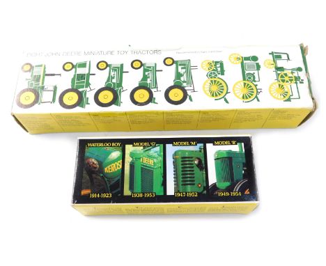 Two John Deere models, comprising a John Deere 1-64 scale Ertl 5523, and eight John Deere miniature toy tractors, boxed. (2) 