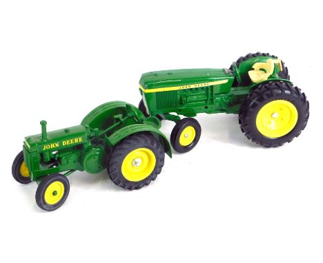 An Ertl John Deere tractor model, and another. (2)