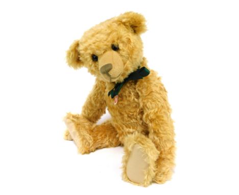 A Steiff mohair Teddy Bear, in caramel with green silk bow, 59cm high, boxed.