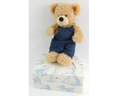 A Steiff mohair teddy bear, in beige, with dungarees, boxed. 