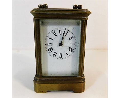 A miniature French brass carriage clock by Henri Jacot, some cracking to enamel face
