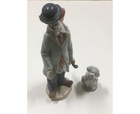 A Lladro figure of clown, approx 8in twinned with a Lladro dog