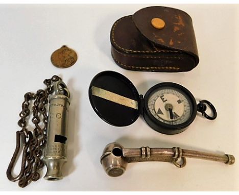 A small compass with case, a bosuns whistle, an L.C.C. (London County Council) "The Metropolitan" General service whistle &am