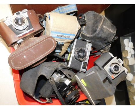 A box of vintage cameras, nine in total 