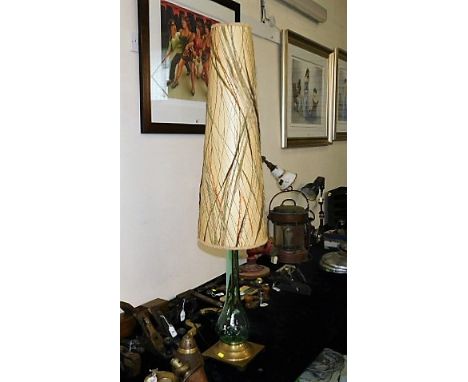 A brass footed tear drop shaped lamp with retro style shade 48in tall