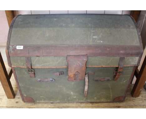 A vintage green canvas and leather bound travelling trunk