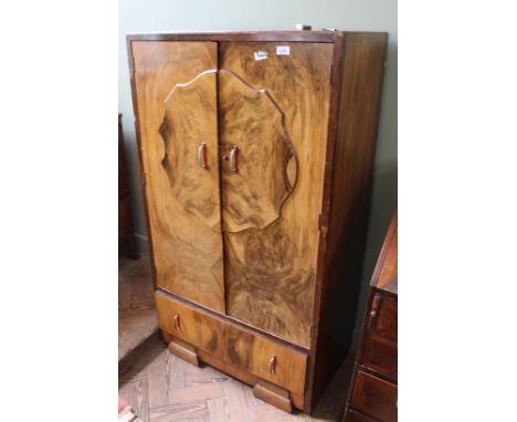 A 1930's veneered wardrobe with single drawer below, of small proportions