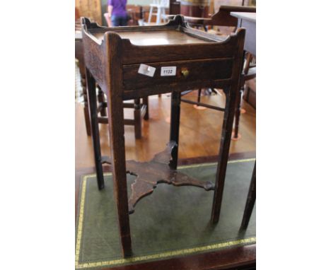 An early 19th Century oak one drawer side table with pot shelf