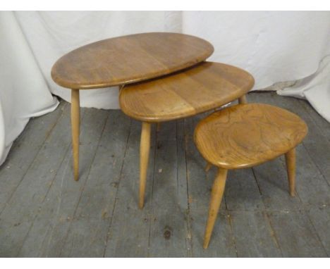 Ercol nest of three tables of oval form with spindle legs, label to base