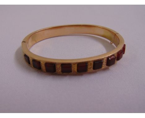 9ct yellow gold and cornelian bangle, approx total weight 14.0g