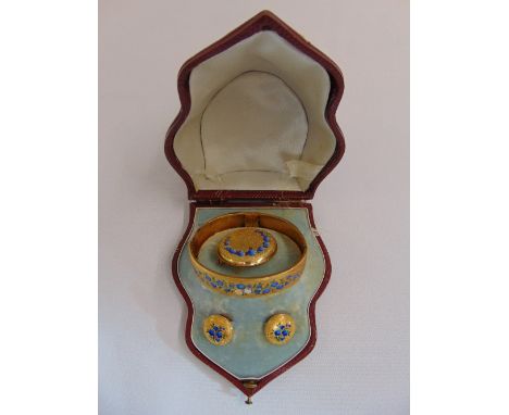 A Victorian suite of yellow gold and enamel jewellery in original fitted leather case to include a bangle, a brooch and two s