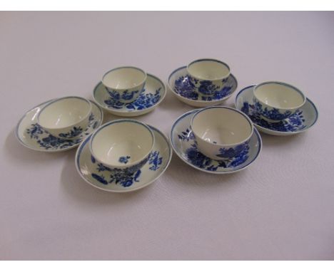 Six Worcester first period tea bowls and saucers decorated with flowers and leaves