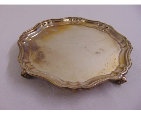 A silver card tray, Chippendale border on four volute scroll feet, Sheffield 1914