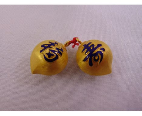 A pair of Korean gold dress buttons with enamel characters (tested 22ct gold) to include original purchase certificate, appro