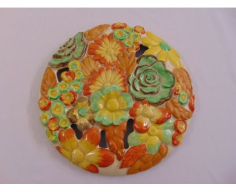 Clarice Cliff My Garden circular wall plaque, pierced and moulded with flower heads, mark to verso, 34cm diameter
