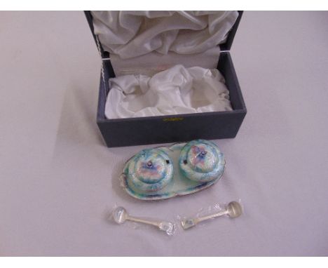 A cased set of Korean white metal and enamel condiments to include a tray, two covered dishes and two condiment spoons