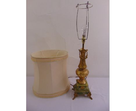 A gilded metal and onyx table lamp of vase form on raised square plinth to include silk shade