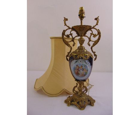 A gilded metal and porcelain table lamp with silk shade