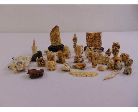 A quantity of ivory and bone Netsuke miniature figurines and an Inro (33)