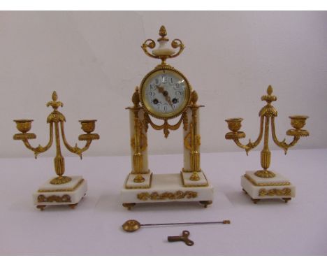 Leroy gilded metal and white marble clock set, white enamel dial, Arabic numerals, two train movement, to include key and pen