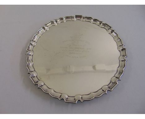 A silver salver, Chippendale border, presentation inscription on four claw feet, Birmingham 1953