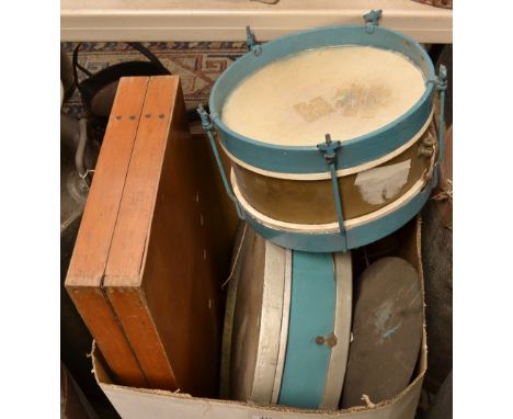 An early 20th century part one-man-band set comprising bass drum, snare drum, cymbals, etc; a wooden picnic table and stools,