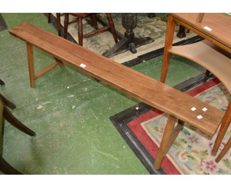 A French fruitwood bench, pegged joints. 42cm tall x 167cm long.