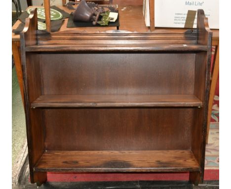 A rustic oak three tier wall shelf. 98cm high x 87cm wide x 23cm deep.