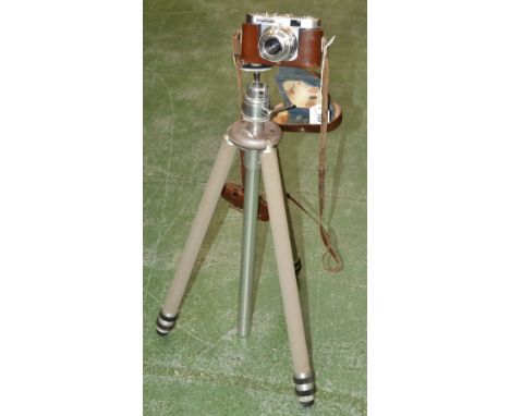 A Voightlander Vito 3 camera, in fitted case; tripod