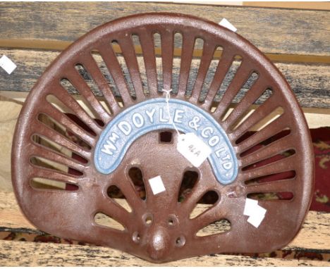 A reproduction cast iron Doyle tractor seat