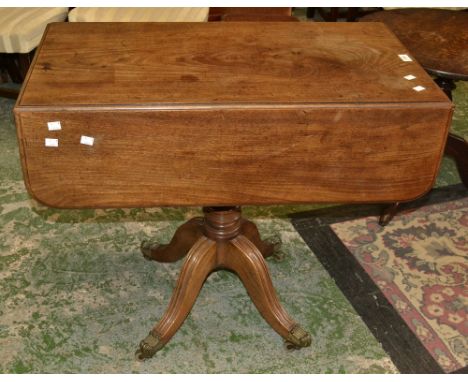 A Regency mahogany Pembroke table, rounded rectangular top, drawer to frieze, button handles, blind drawer to verso, turned c