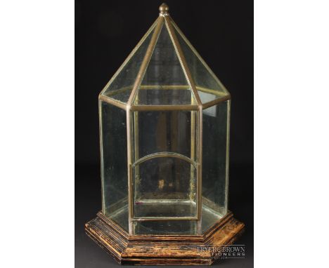 A hexagonal glass lantern, on ebonised wood base, 41cm high approx.