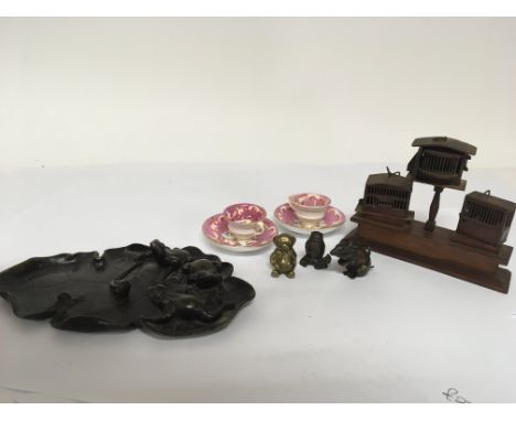 An Oriental bronze in the form of a Lilly pond leaf surmounted with frogs signed base diameter 18cm three other miniature bro