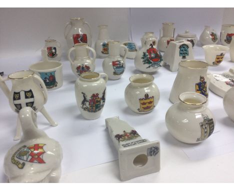 A collection of 55 items of WH Goss ware with various crest and model shapes .
