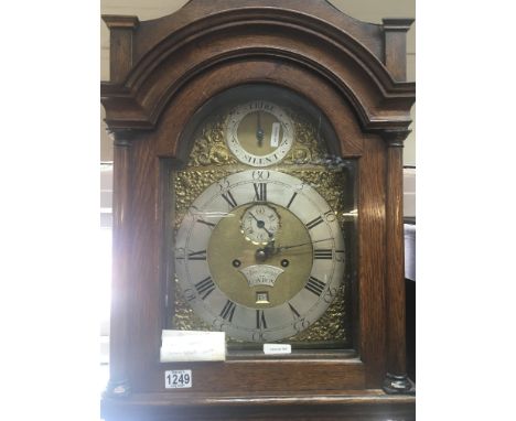 An oak longcase clock the brass dial with silvered chapter ring maker Sam Cannon London eight day going with pendulum and wei