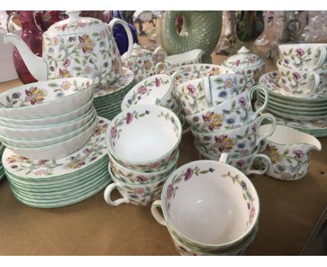A Minton porcelain dinner and tea service Haddon Hall pattern with flowers on a white ground some second quality, no obvious 