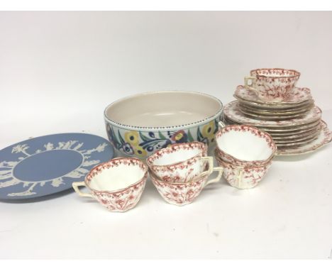 A Poole pottery bowl a Wedgwood Jasperware plate and a late Victorian tea set with a red floral pattern on a white ground.- N
