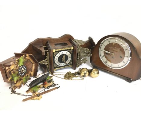 An Alexander Clark mantle clock and two wall clocks. This lot cannot be posted