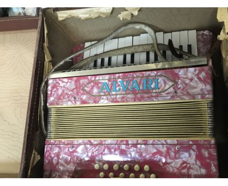 A cased Alvari accordion, postage category C