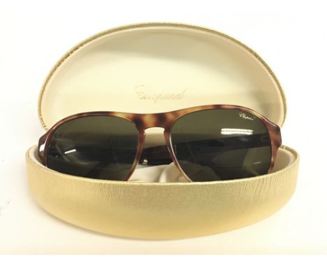 A cased pair of Chopard SCH 134 sunglasses. Postage category A