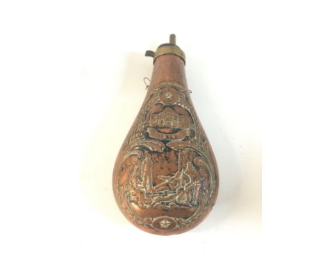 A brass and copper powder flask with an image of soldiers and the date 1836.