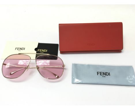 A pair of Fendi sunglasses with pink lenses. Comes with case pouch and card.