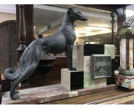 A Art Deco mantel clock the square dial flanked by a dog on a pink marble Base .49 x 36 cm