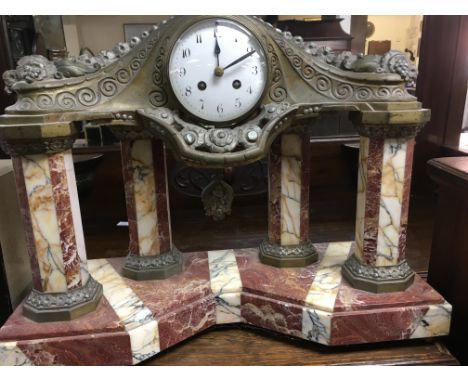 A marble mantle clock the circular enamel dial with Arabic numerals drop Pendulum with art Nouveau influence. 40 cm 40 cm .