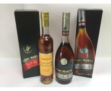 Three bottles of Remy Martin cognac and a bottle of Calvados (4). Shipping category D