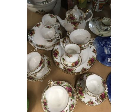 A Royal Albert County rose tea set including teapot milk jug dinner plates cups saucers.